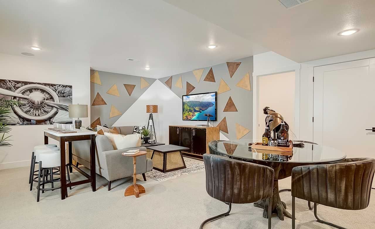 Modern living room Westerly community. Geometric feature wall, plush seating, minimalistic decor, art, TV unit.