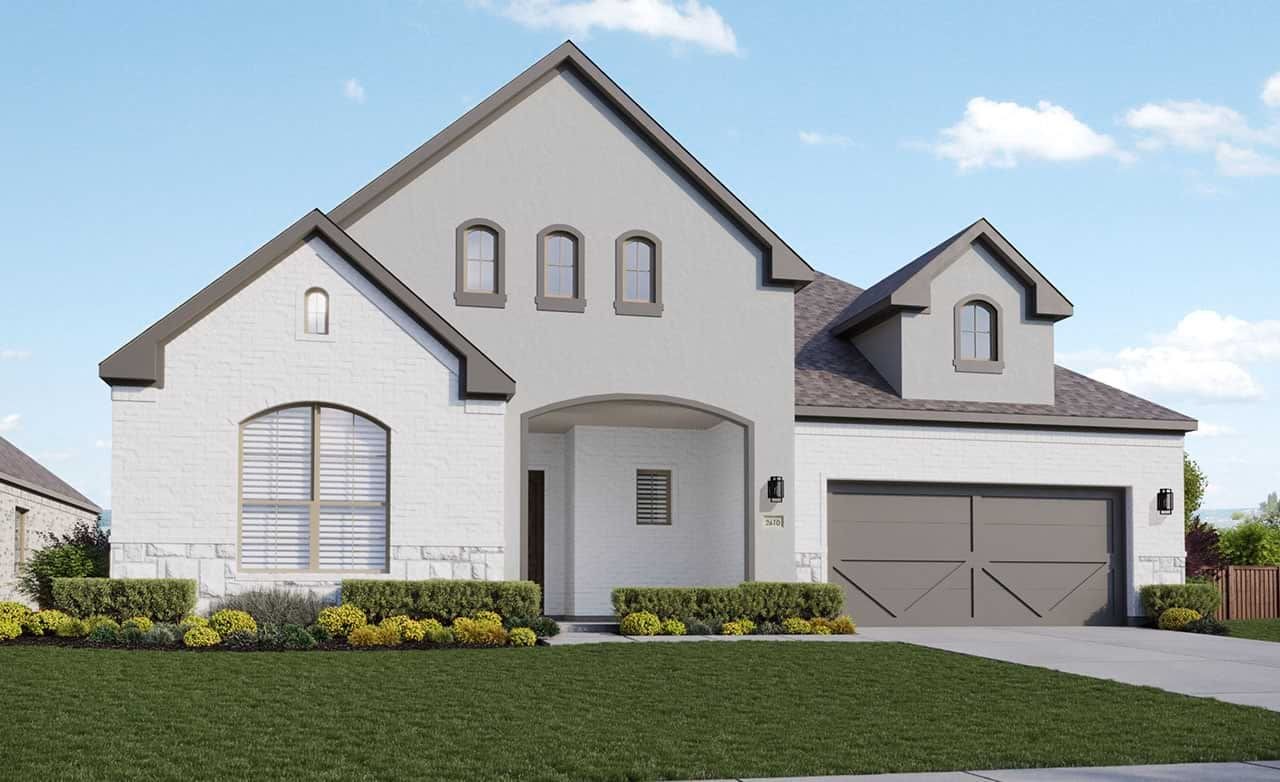 Elegant white brick home, gabled roof, arch windows, manicured lawn at Kelly Ranch Rio Vista.