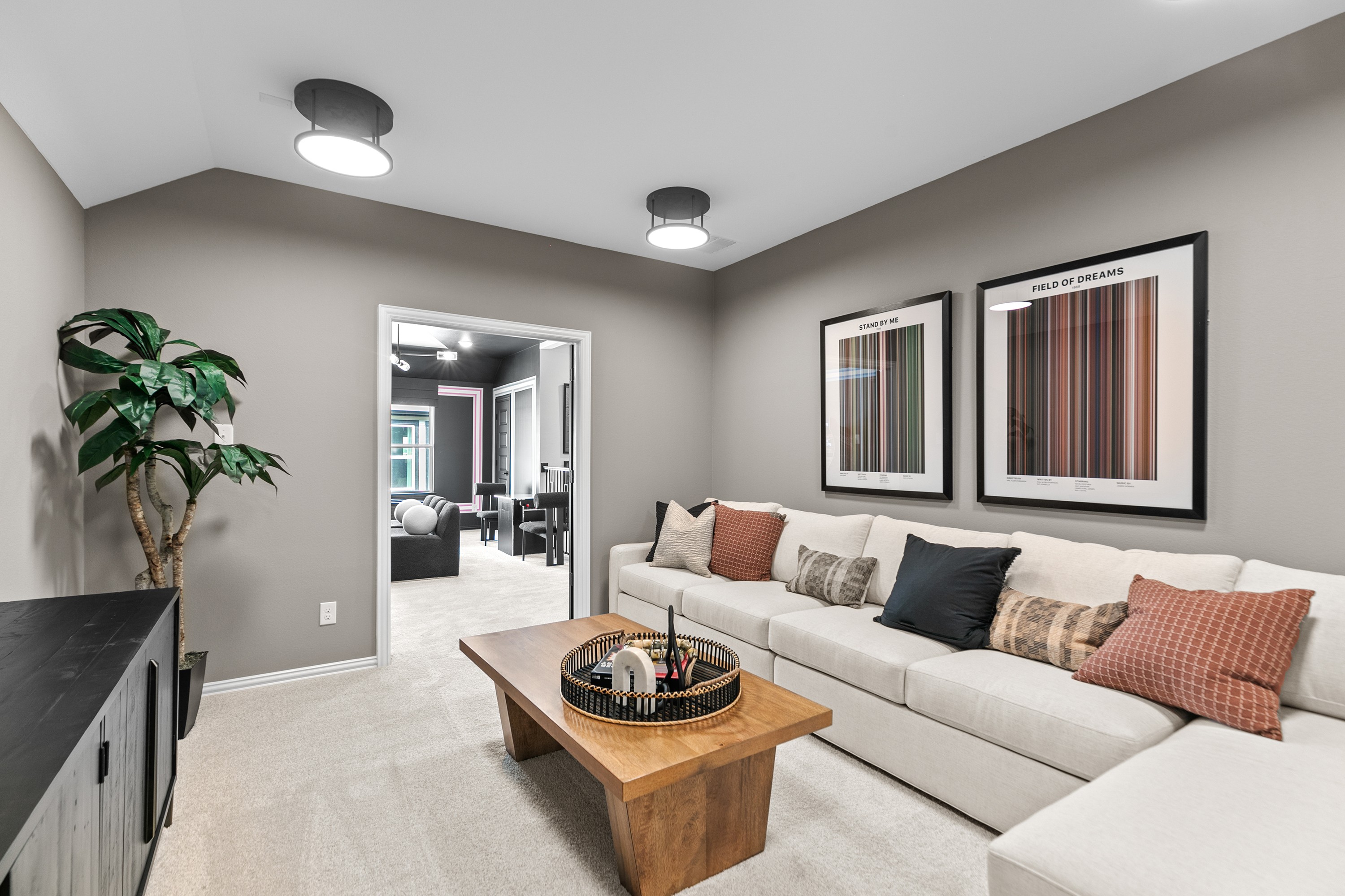 Modern Living Room with Sectional Sofa in River Ranch Community Modern living room with beige sectional sofa, framed art, wood table in River Ranch community.