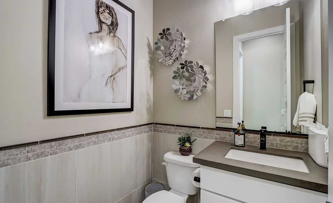 Modern Powder Room Design in Hacienda Community Elegant powder room with modern art, decorative wall accents, and stylish fixtures in Hacienda community.