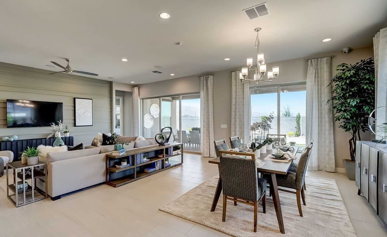 Luxurious Living and Dining Space with Canyon Views in Hacienda Elegant modern living and dining area with panoramic canyon views, large windows, and luxurious decor in Hacienda community.