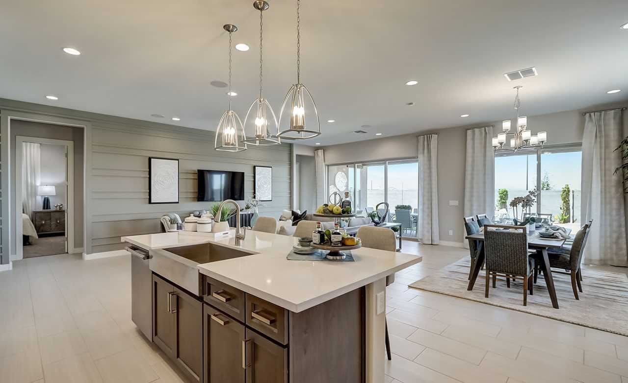 Modern Kitchen and Dining Area in Hacienda Community Home Spacious modern kitchen and dining area with stylish lighting, large windows, and sleek finishes in Hacienda community.