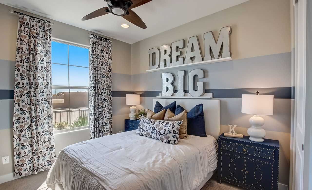 Elegant Bedroom Decor at Castillo Anderson Parc, Arizona Chic bedroom with large "Dream Big" sign, plush bedding, and stylish decor, Castillo at Anderson Parc, Arizona.