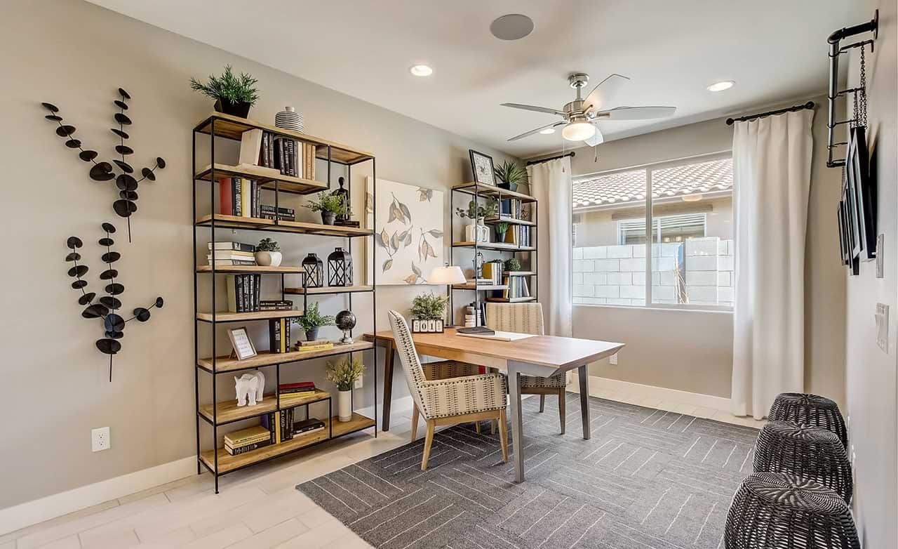 Contemporary Home Office Design in Anderson Parc Community Modern home office with stylish shelving, decorative wall art, and large window in Anderson Parc community.