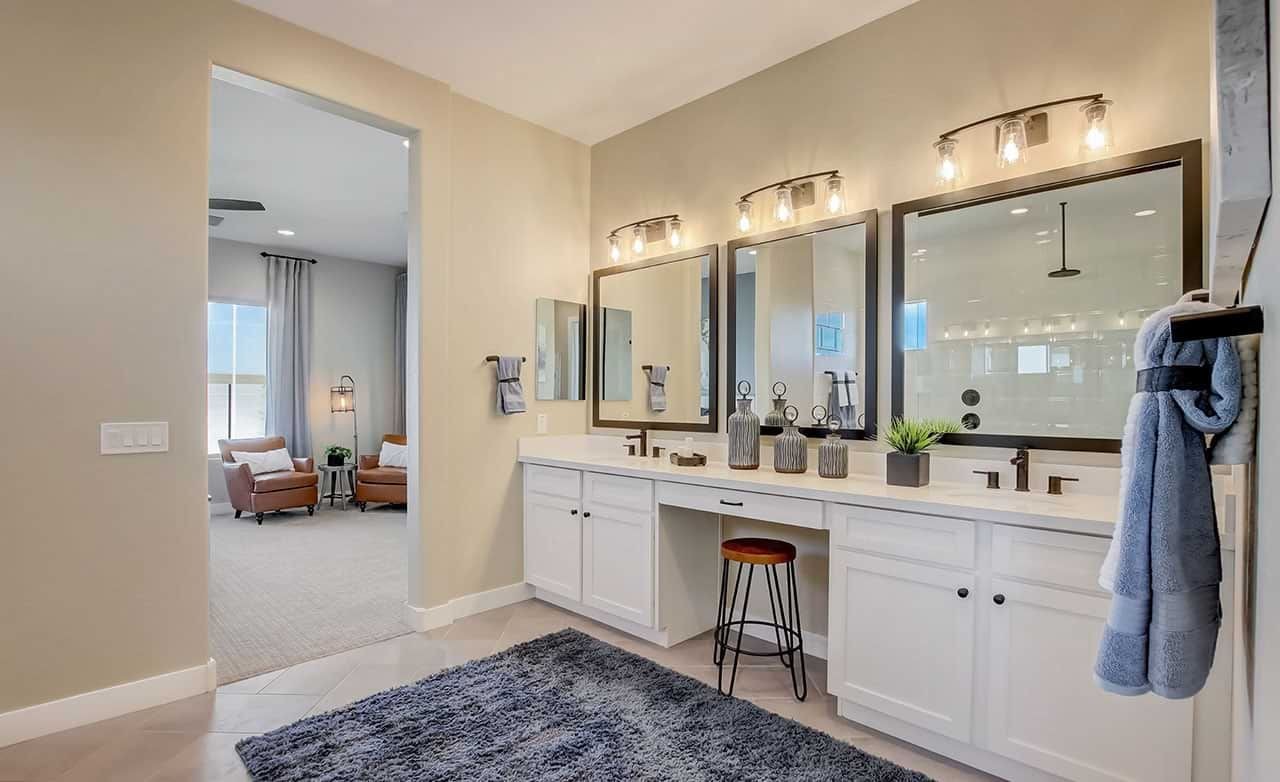 Elegant Bathroom in Mirada Crossing with Double Vanity and Modern Design Luxurious bathroom with double vanity, large mirrors, modern lights in Mirada Crossing community.