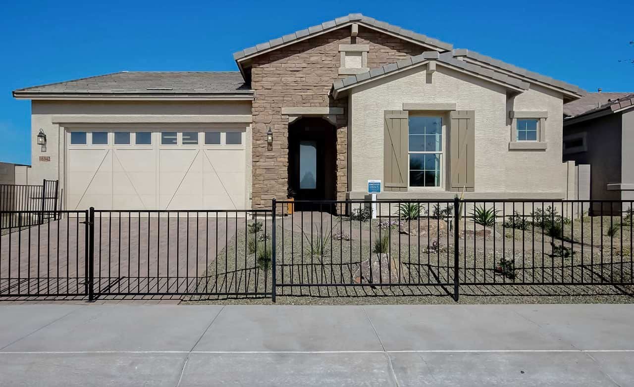 Modern Stone and Stucco Home at Mirada Crossing Single-story stone and stucco home with desert landscaping, fenced yard, located in Mirada Crossing community.
