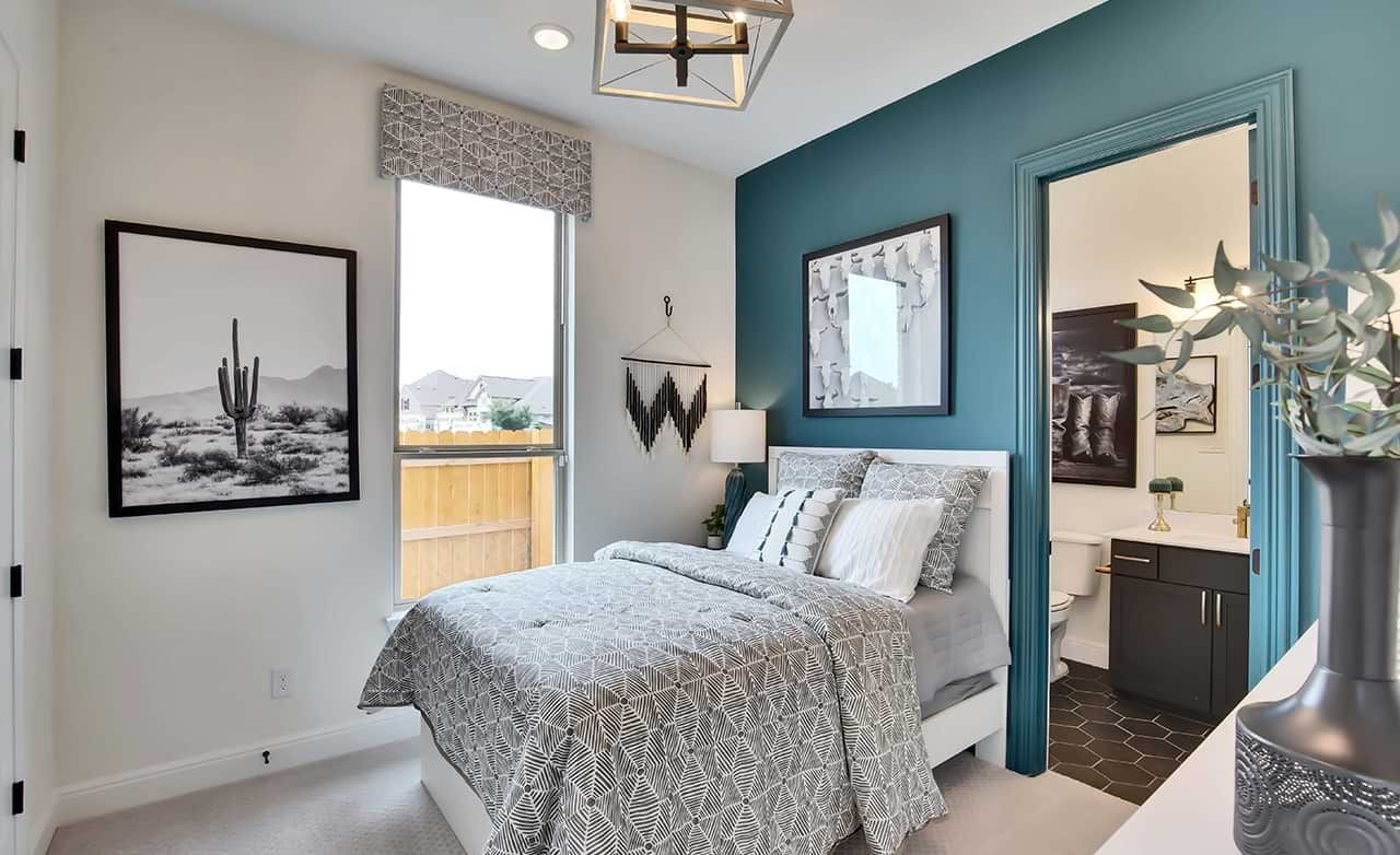 Modern Bedroom with Teal Accent Wall in San Gabriel Home Bedroom with modern decor, teal accent wall, cactus art, and window. San Gabriel home luxury interior design.