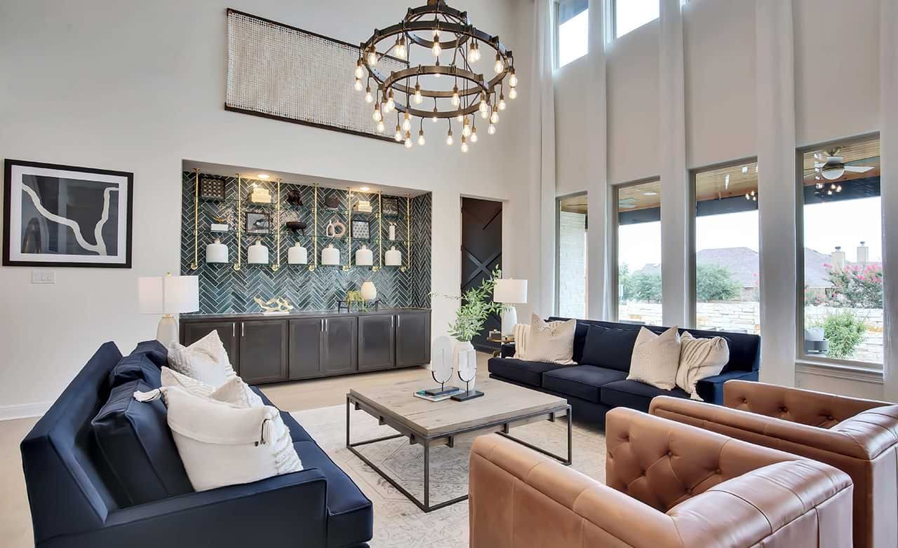 Luxurious Living Room at Oaks at San Gabriel, Georgetown, Texas Elegant living room with high ceilings, chandelier, and modern decor at Oaks at San Gabriel, Georgetown, TX.